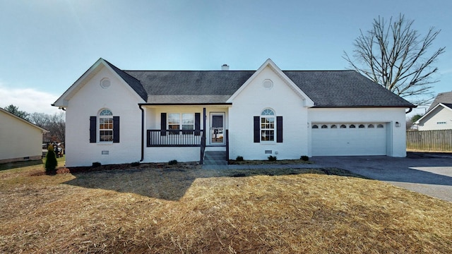 ranch-style house with aphalt driveway, brick siding, a porch, and an attached garage