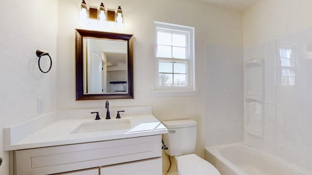 bathroom featuring toilet, shower / washtub combination, and vanity