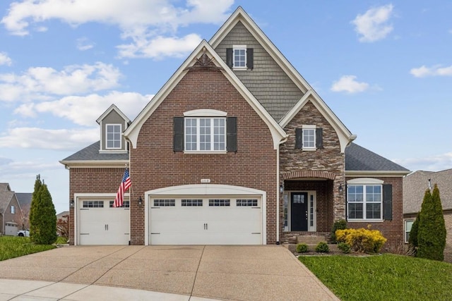 view of front of home featuring stone siding, brick siding, concrete driveway, and an attached garage