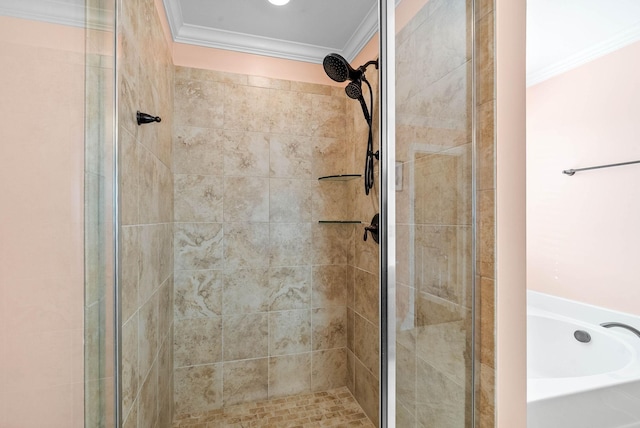 bathroom with a stall shower, ornamental molding, and a bath