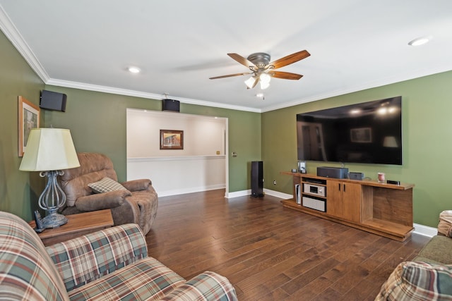 living area featuring baseboards, a ceiling fan, crown molding, and hardwood / wood-style flooring