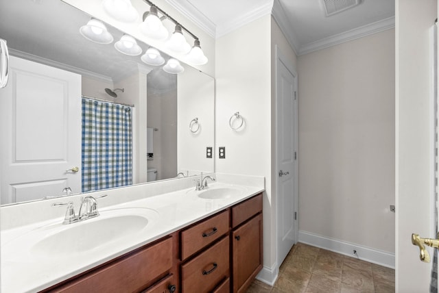 bathroom with double vanity, ornamental molding, visible vents, and a sink