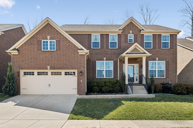 view of front of property with a front yard, brick siding, a garage, and driveway