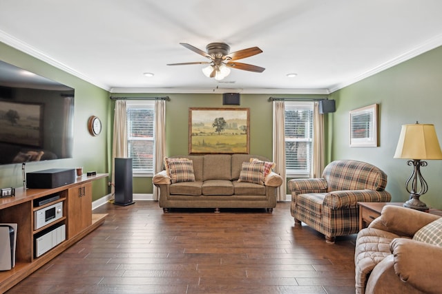 living area featuring plenty of natural light, crown molding, and dark wood-style flooring