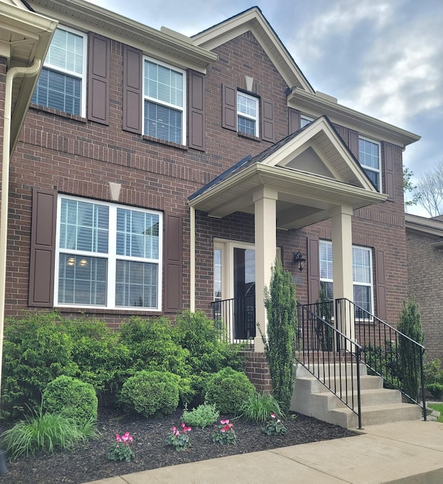 view of front of house with brick siding
