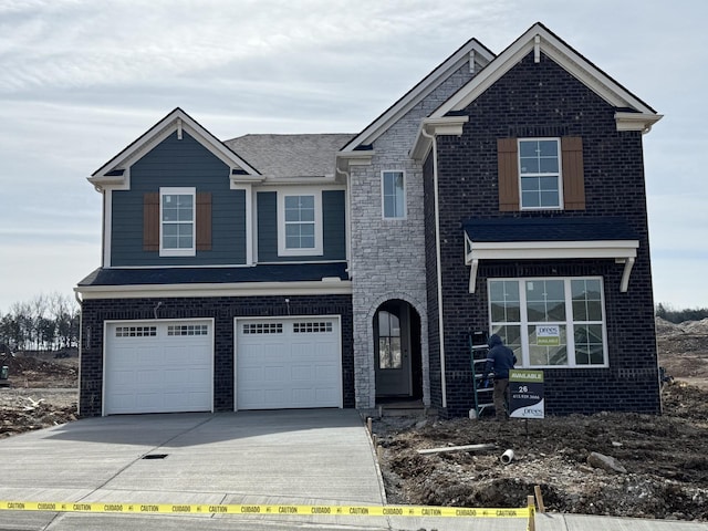 view of front of property featuring brick siding, concrete driveway, and a garage