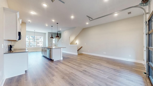 kitchen with visible vents, light wood finished floors, a sink, appliances with stainless steel finishes, and white cabinetry