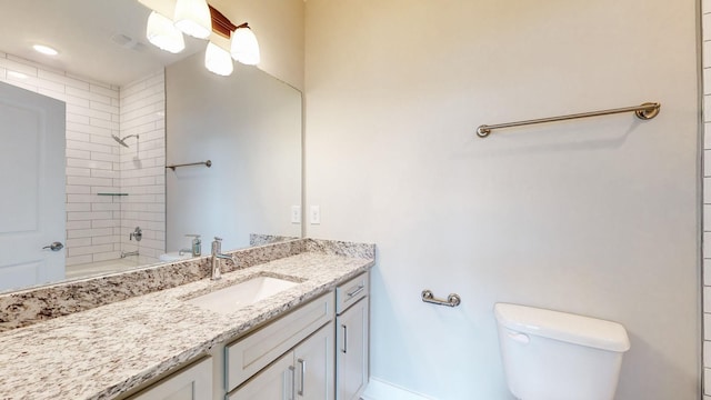 bathroom featuring vanity, toilet, and shower / bathtub combination