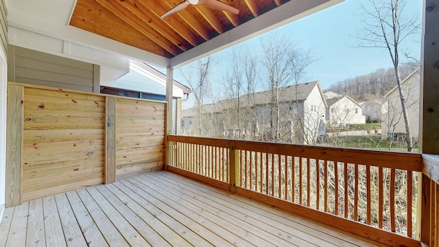 wooden deck featuring ceiling fan