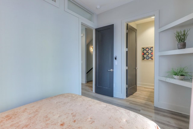 bedroom featuring light wood-style floors