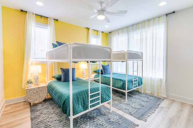 bedroom with recessed lighting, wood finished floors, baseboards, and ceiling fan