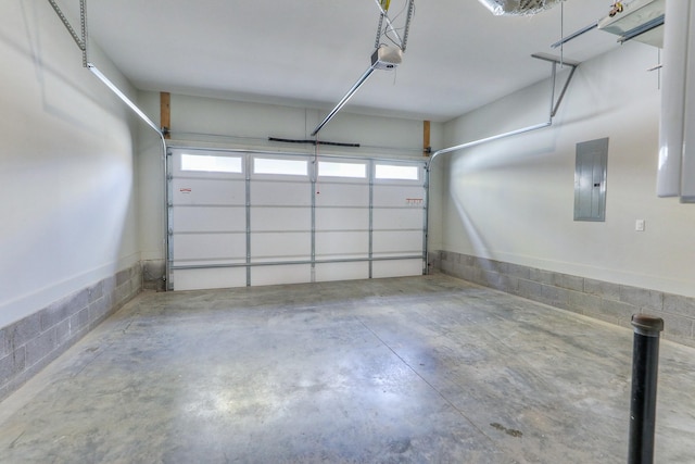 garage with electric panel and a garage door opener