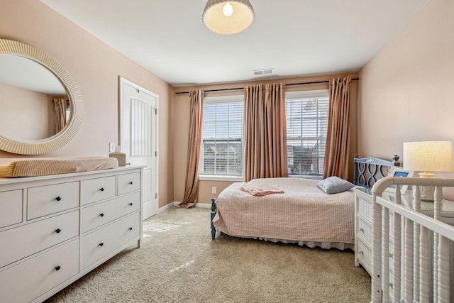 bedroom featuring baseboards and light colored carpet