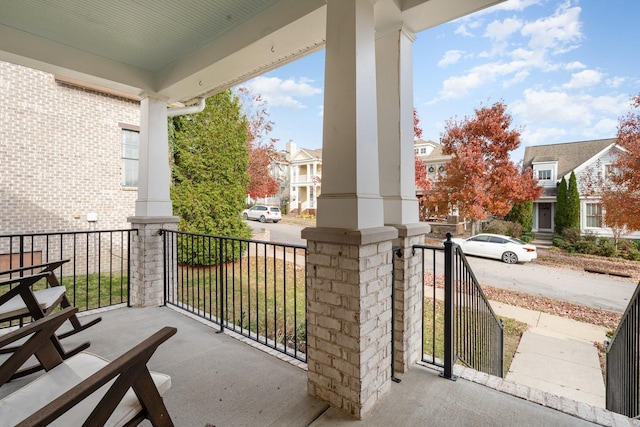 balcony featuring a residential view and a porch