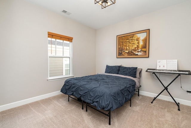 bedroom with carpet flooring, baseboards, and visible vents