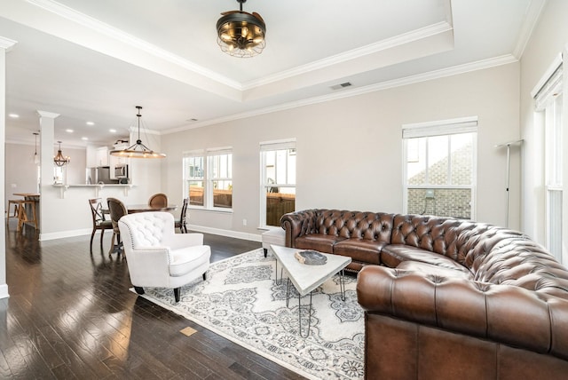 living area featuring a raised ceiling, baseboards, visible vents, and dark wood-type flooring