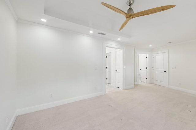 spare room featuring light carpet, visible vents, recessed lighting, and baseboards