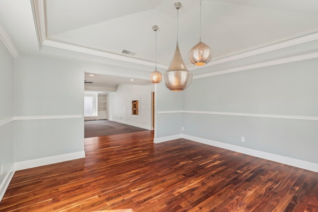 spare room with wood finished floors, baseboards, visible vents, and ornamental molding