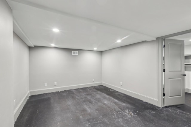 finished below grade area with visible vents, recessed lighting, and baseboards