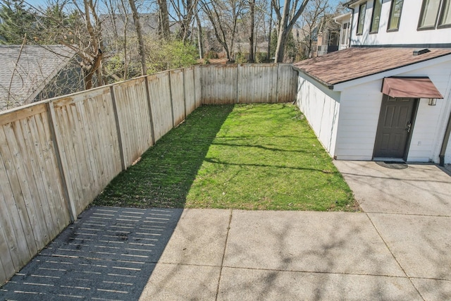 view of yard with a fenced backyard