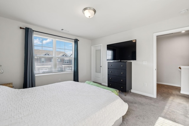 bedroom featuring visible vents, baseboards, and carpet flooring