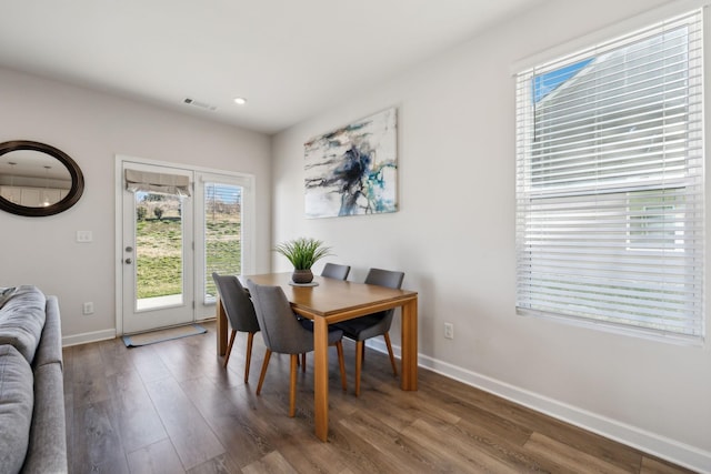 dining area with recessed lighting, wood finished floors, visible vents, and baseboards