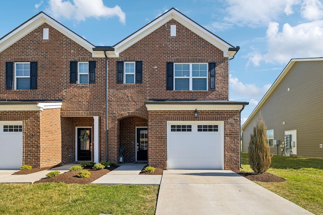 view of front facade with a garage, brick siding, concrete driveway, and a front yard