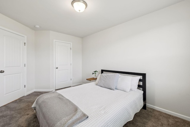 carpeted bedroom featuring baseboards