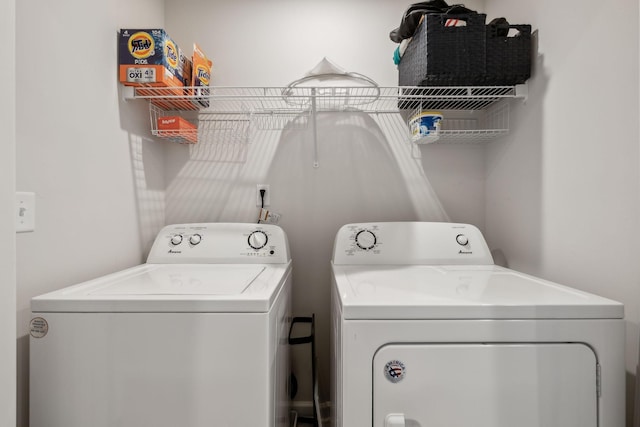 washroom with washer and dryer