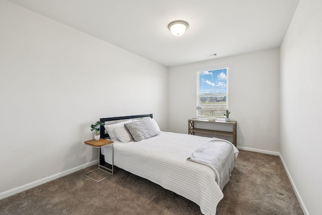 bedroom featuring baseboards, carpet floors, and visible vents