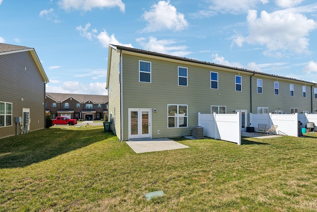 back of house featuring a patio area, cooling unit, a yard, and fence