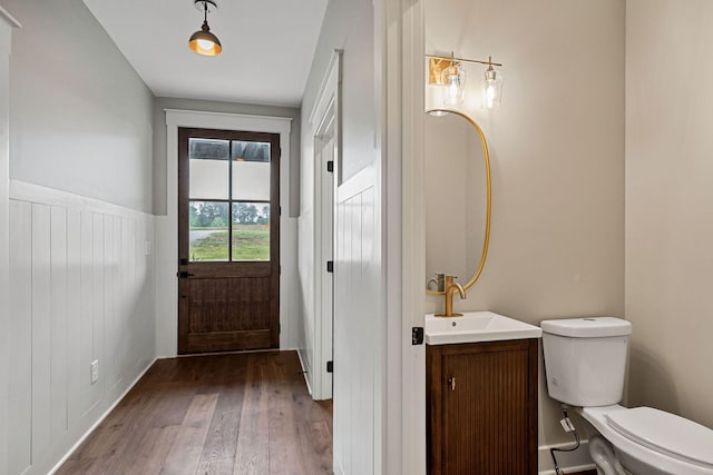 1036 Hidden River Rd, Rock Island, TN 38581 - doorway with a sink, wood finished floors, and wainscoting