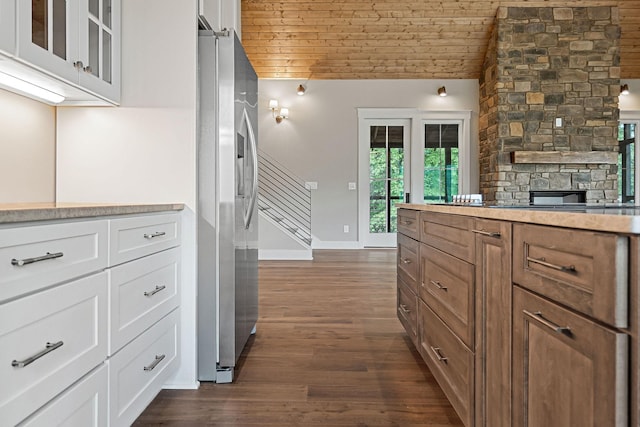 1036 Hidden River Rd, Rock Island, TN 38581 - kitchen featuring stainless steel fridge with ice dispenser, wooden ceiling, dark wood-style flooring, white cabinetry, and vaulted ceiling