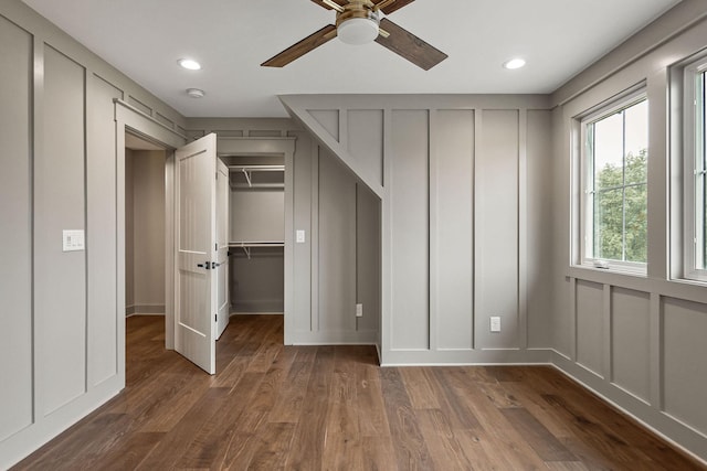 1036 Hidden River Rd, Rock Island, TN 38581 - unfurnished bedroom featuring a decorative wall, wood finished floors, a walk in closet, recessed lighting, and ceiling fan