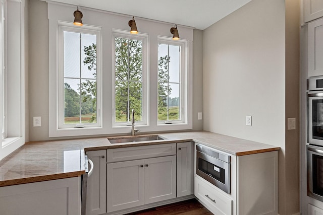 1036 Hidden River Rd, Rock Island, TN 38581 - kitchen with plenty of natural light, a sink, light countertops, and stainless steel microwave