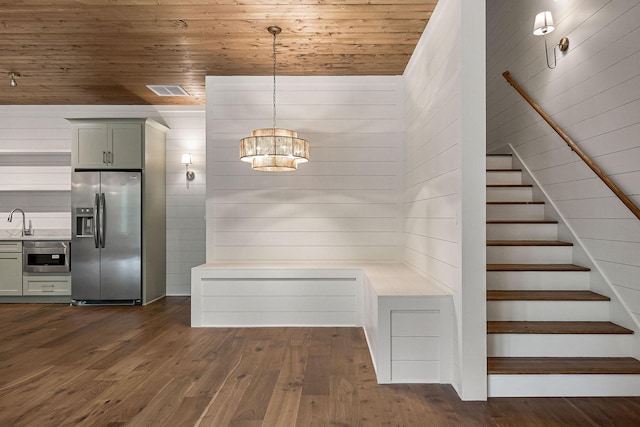 1036 Hidden River Rd, Rock Island, TN 38581 - mudroom featuring a chandelier, wood ceiling, a sink, dark wood-style flooring, and wooden walls
