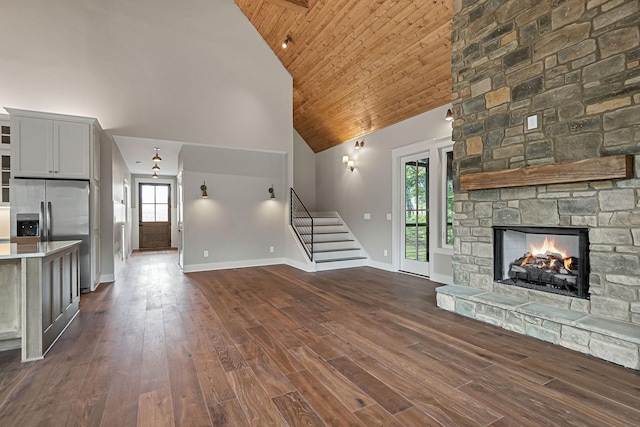 1036 Hidden River Rd, Rock Island, TN 38581 - unfurnished living room featuring high vaulted ceiling, stairs, plenty of natural light, wooden ceiling, and baseboards