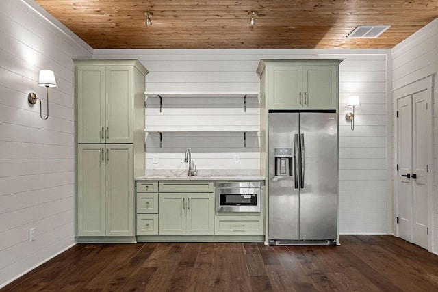1036 Hidden River Rd, Rock Island, TN 38581 - kitchen with stainless steel appliances, green cabinets, wooden ceiling, a sink, and wood walls