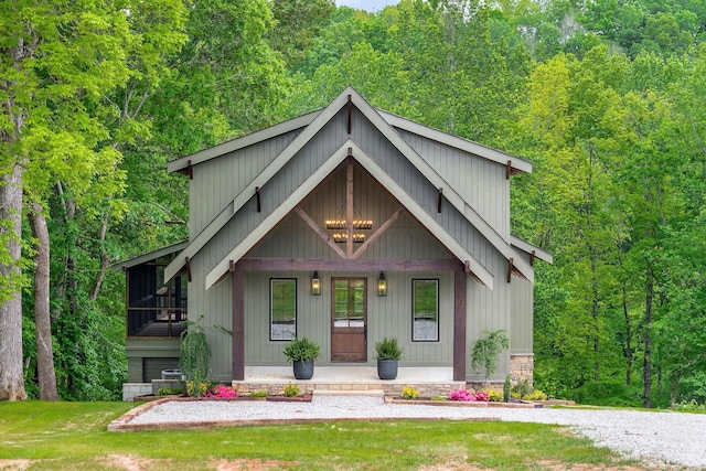 1036 Hidden River Rd, Rock Island, TN 38581 - view of front of house featuring a porch, a wooded view, and board and batten siding