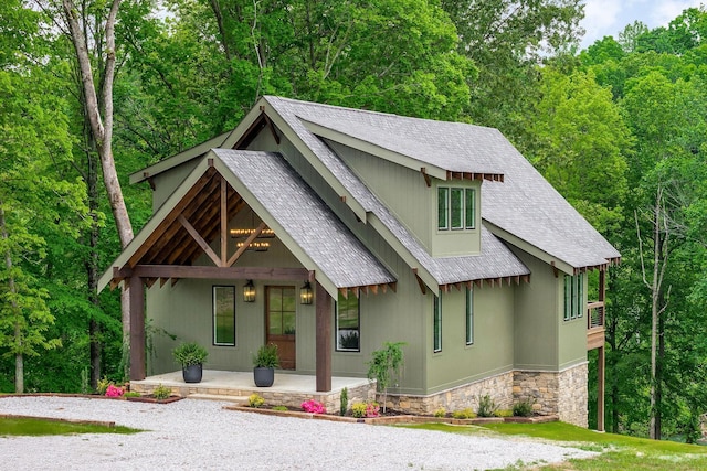 1036 Hidden River Rd, Rock Island, TN 38581 - view of front of home with covered porch, a shingled roof, and stone siding