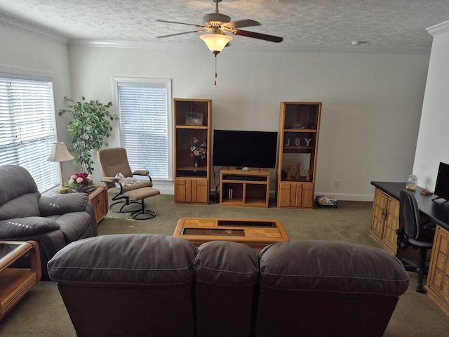 living room with ceiling fan, crown molding, carpet floors, and a textured ceiling