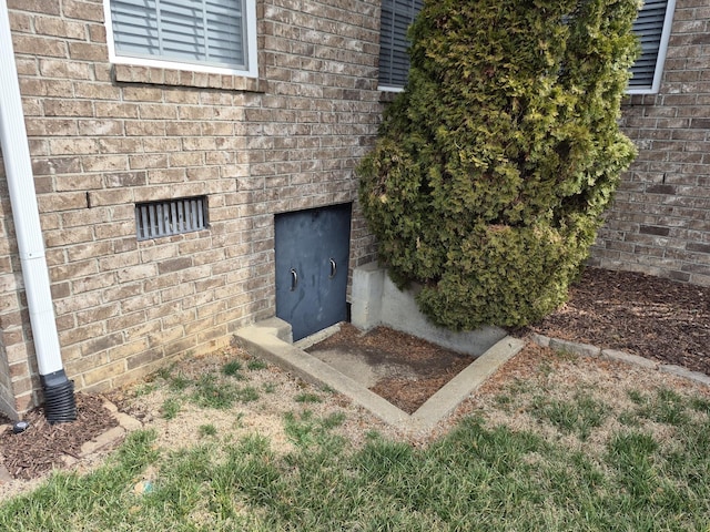 exterior space with brick siding