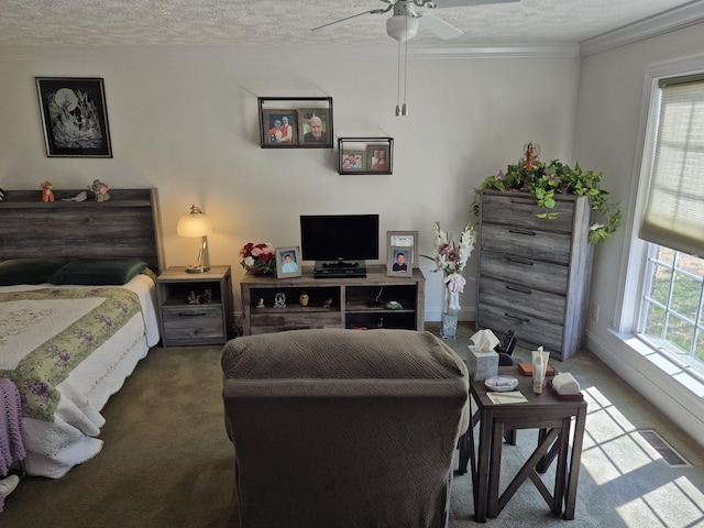 bedroom featuring visible vents, multiple windows, a textured ceiling, and carpet floors