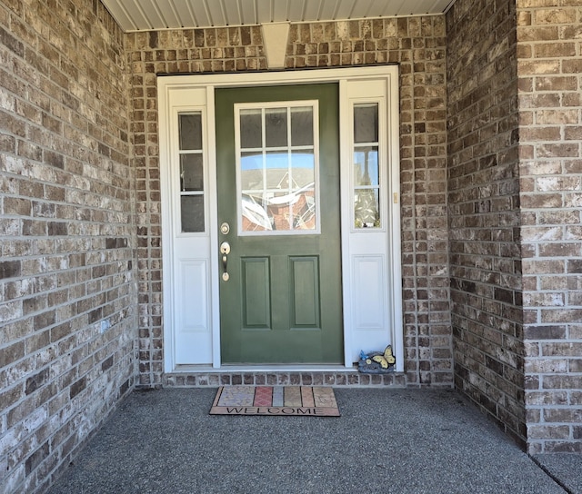 property entrance with brick siding