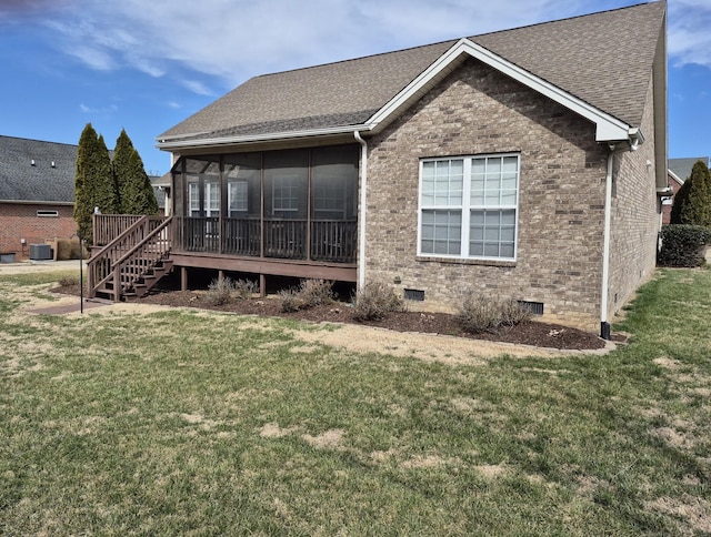 back of house featuring stairway, a yard, a shingled roof, crawl space, and brick siding