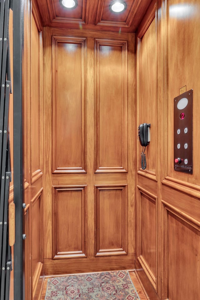 interior details featuring elevator, recessed lighting, and ornamental molding