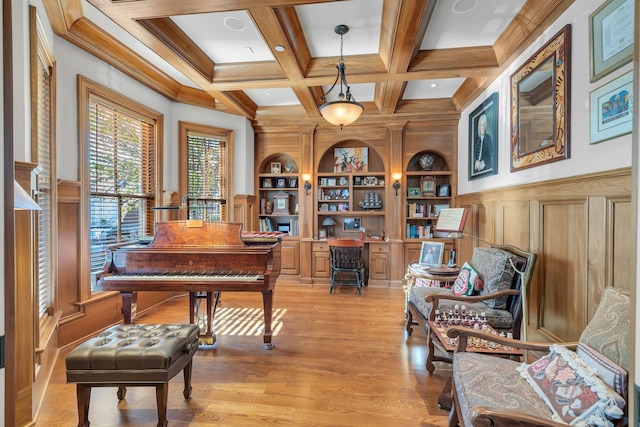 interior space featuring beamed ceiling, built in features, light wood-type flooring, and coffered ceiling