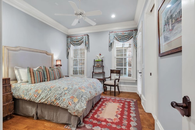 bedroom featuring wood finished floors, baseboards, recessed lighting, ceiling fan, and crown molding