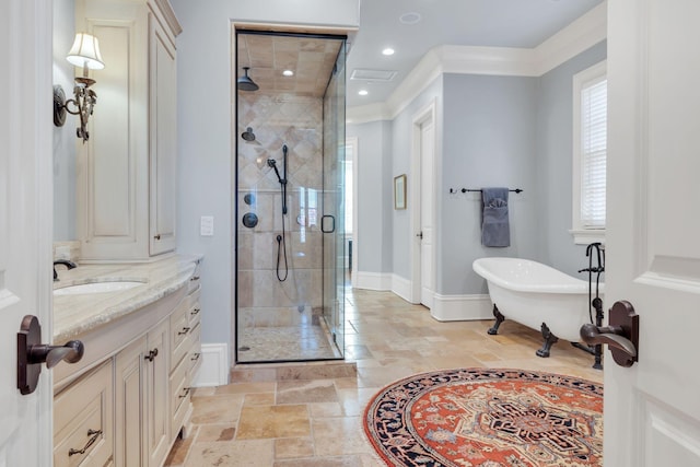 bathroom with a shower stall, baseboards, stone tile floors, a soaking tub, and vanity