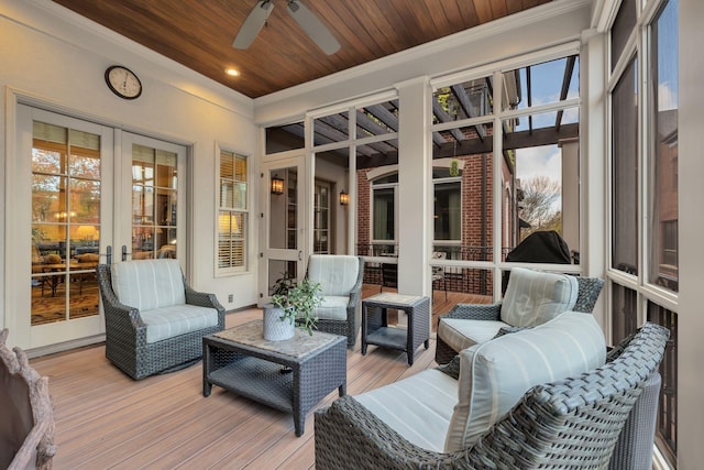 sunroom / solarium with french doors, wood ceiling, and ceiling fan